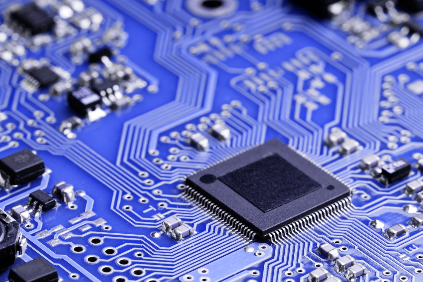 Blue circuit board with a central microchip